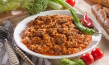 Куриные желудочки с гречкой в томатной пасте